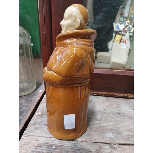 22 - Two Scotch Whiskey ceramic advertising bottles in the form of Monks. {28 cm H x 10 cm Dia.}.