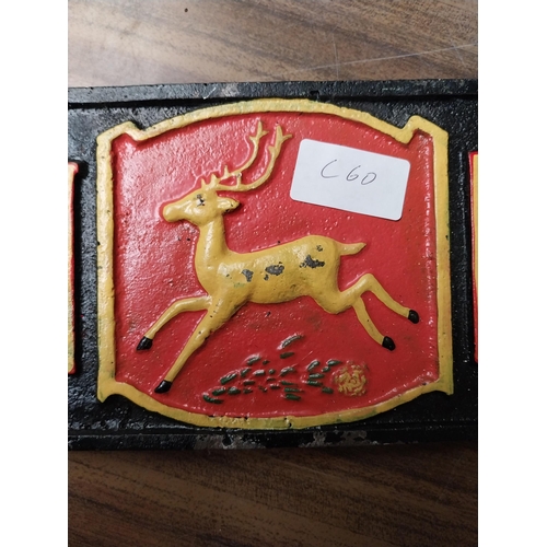 236 - John Deere cast iron advertising sign. {5 cm H x 40 cm W}.