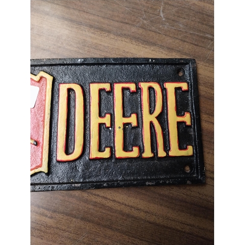 236 - John Deere cast iron advertising sign. {5 cm H x 40 cm W}.