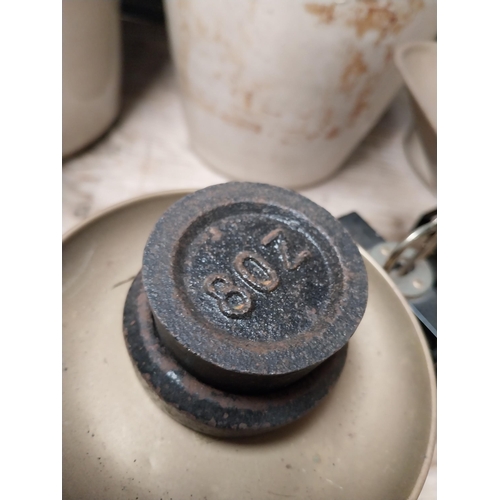 238 - Brass and cast iron Sweet scales with weights. {16 cm H x 29 cm W x 19 cm D}.