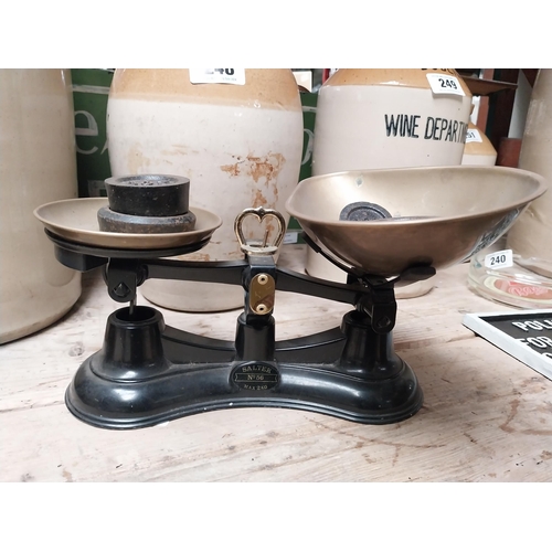 238 - Brass and cast iron Sweet scales with weights. {16 cm H x 29 cm W x 19 cm D}.