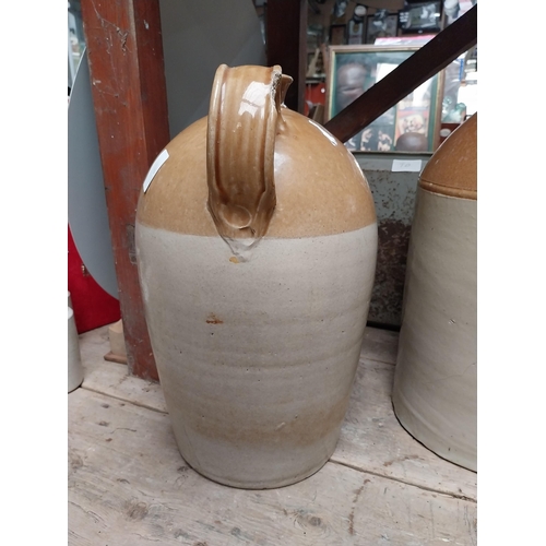 243 - L Egan North King Street Dublin Two gallon stoneware whiskey flagon. {49 cm H x 32 cm Dia.}.