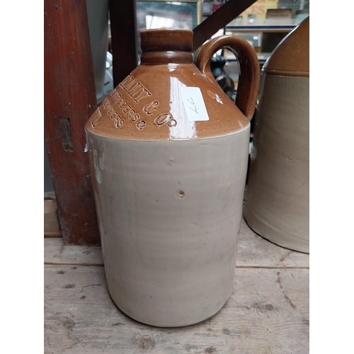 245 - John Mulcahy Clonmel stoneware flagon. {33 cm H x 16 cm Dia.}.