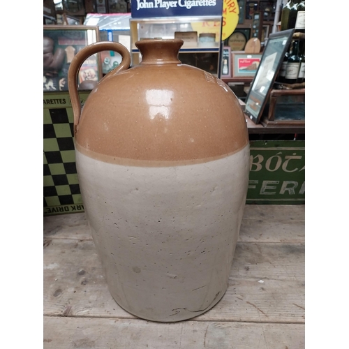 246 - Williams Gibbons Wholesale Merchant Castlebar four gallon stoneware flagon. {47 cm H x 27 cm Dia.}.