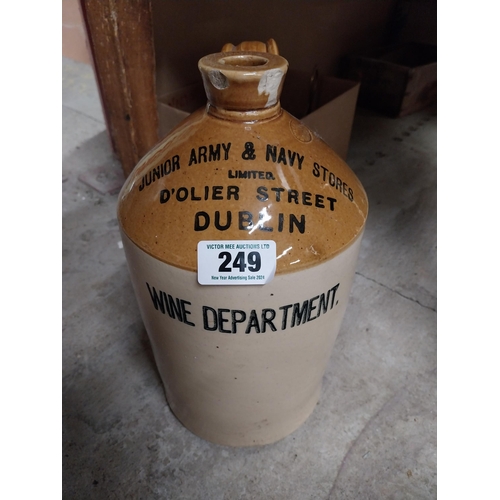 249 - Army and Navy Stores Dublin Wine Dept stoneware flagon. {24 cm H x 18 cm Dia.}.