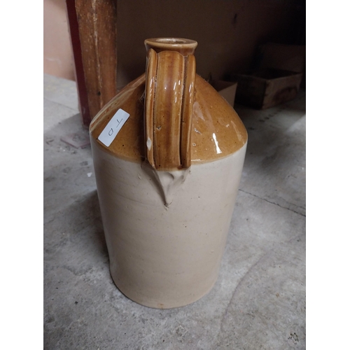 249 - Army and Navy Stores Dublin Wine Dept stoneware flagon. {24 cm H x 18 cm Dia.}.