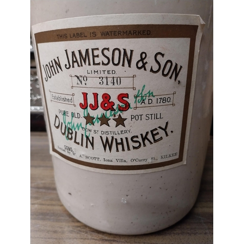 251 - John Jameson Dublin half gallon stoneware whiskey flagon. {26 cm H x 15 cm Dia.}