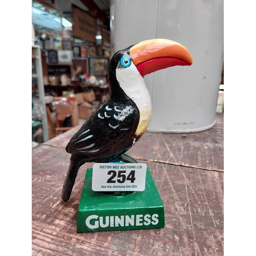 254 - Cast iron Guinness Toucan. {15 cm H x 11 cm W x 7 cm D}.