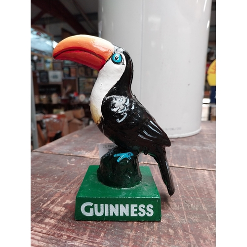 254 - Cast iron Guinness Toucan. {15 cm H x 11 cm W x 7 cm D}.