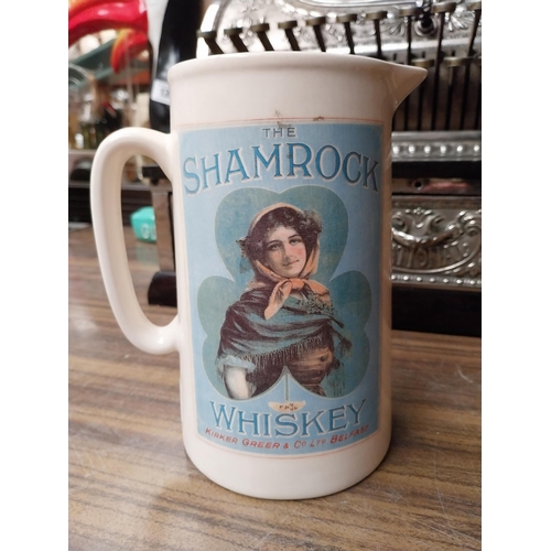 256 - Shamrock Whiskey ceramic advertising water jug. {18 cm H x 16 cm W x 12 cm D}.