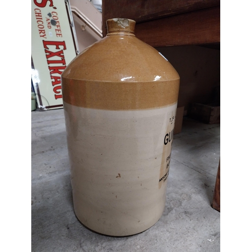 264 - Guinness and Co four gallon stoneware whiskey flagon. {47 cm H x  26 cm Dia.}.