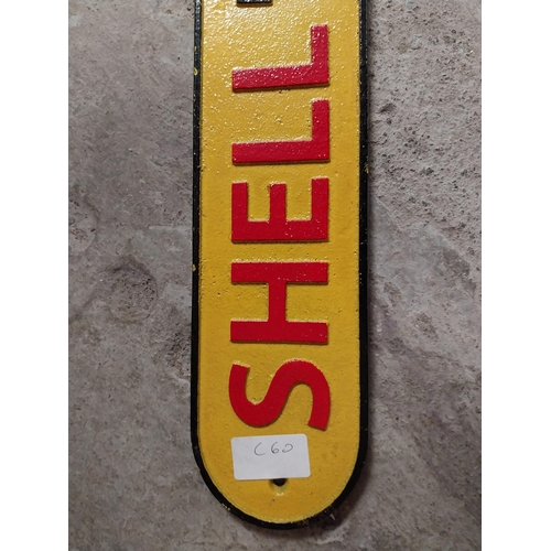 265 - Shell Motor Spirit Sold here cast iron wall plaque. {8 cm H x 50 cm W}.