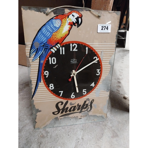 274 - 1960's Sharps glass battery advertising clock. {43 cm H x 30 cm W}.