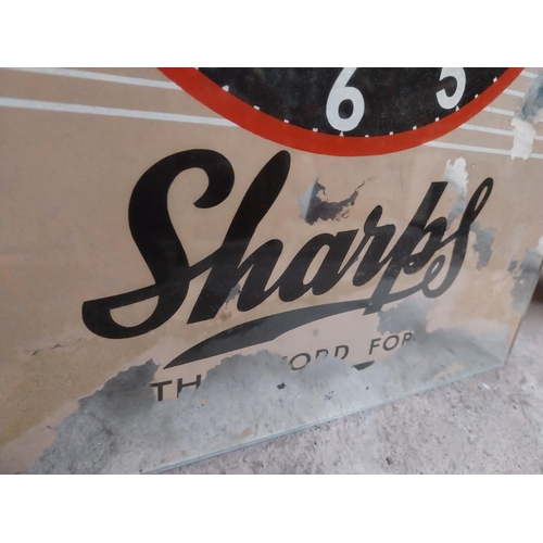 274 - 1960's Sharps glass battery advertising clock. {43 cm H x 30 cm W}.