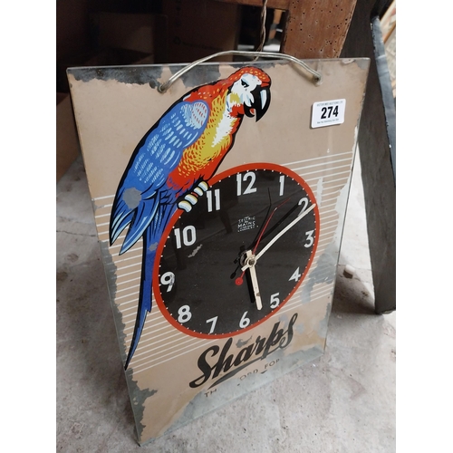 274 - 1960's Sharps glass battery advertising clock. {43 cm H x 30 cm W}.