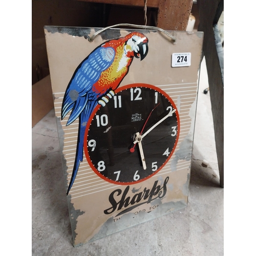 274 - 1960's Sharps glass battery advertising clock. {43 cm H x 30 cm W}.