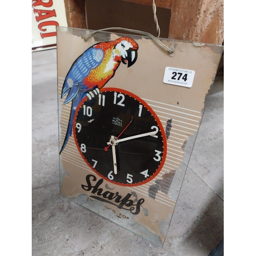 274 - 1960's Sharps glass battery advertising clock. {43 cm H x 30 cm W}.