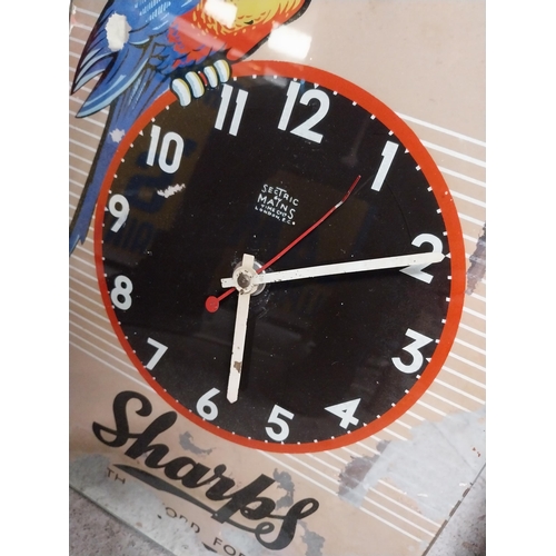 274 - 1960's Sharps glass battery advertising clock. {43 cm H x 30 cm W}.