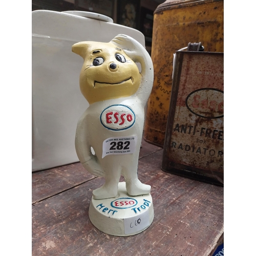 282 - Cast iron Model of Esso man. {23 cm H x 10 cm W x 9 cm D}.