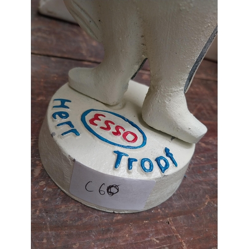 282 - Cast iron Model of Esso man. {23 cm H x 10 cm W x 9 cm D}.