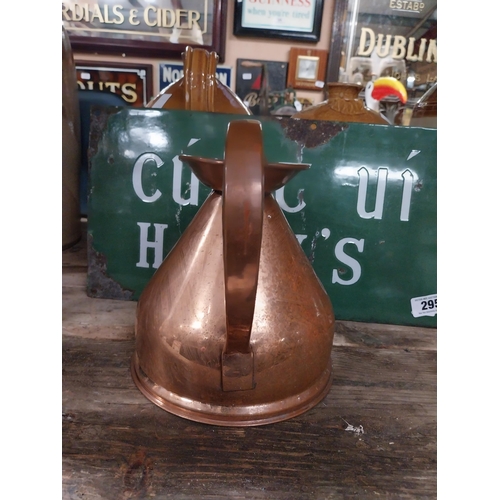 296 - Set  of four graduated copper haystack measures. {28 cm H x 30 cm Dia. to 12 cm H x 13 cm Dia.}