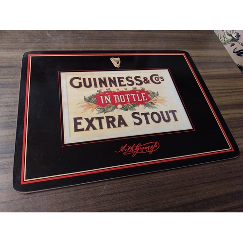 308 - Seven Guinness beer mats various sizes. {22 cm H x 30 cm W  to 10 cm H x 10 cm W}.