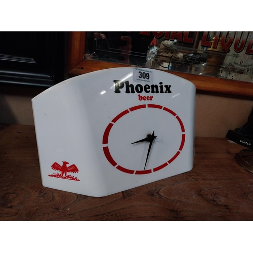 309 - 1960's Phoenix Beer Perspex battery advertising clock. {21 cm H x 37 cm W}.