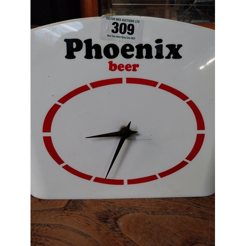 309 - 1960's Phoenix Beer Perspex battery advertising clock. {21 cm H x 37 cm W}.