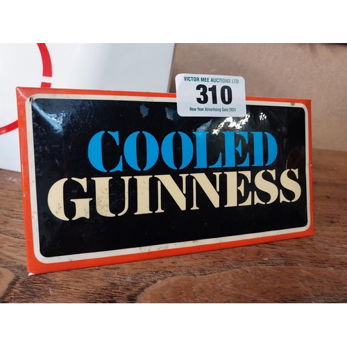 310 - Cooled Guinness celluloid shelf advertising sign. {10 cm H x 18 cm W}.