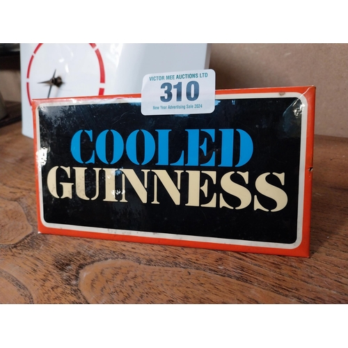 310 - Cooled Guinness celluloid shelf advertising sign. {10 cm H x 18 cm W}.