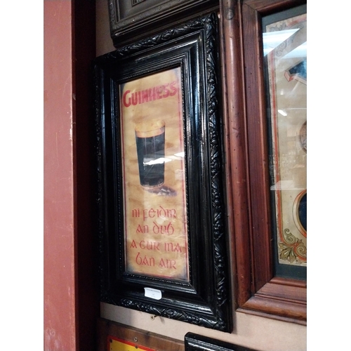 322 - Framed Guinness print as Gaeilge. {54 cm H x 30 cm W}.