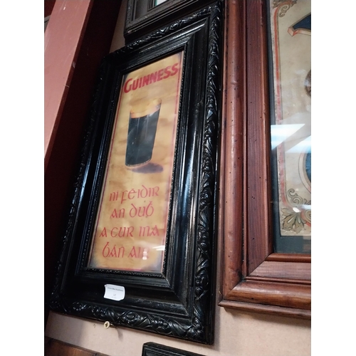 322 - Framed Guinness print as Gaeilge. {54 cm H x 30 cm W}.