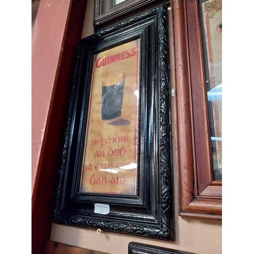 322 - Framed Guinness print as Gaeilge. {54 cm H x 30 cm W}.