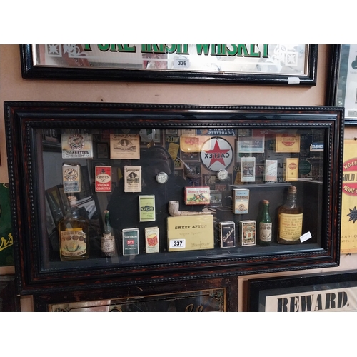 337 - Framed collage of Whiskey bottles, Cigarettes boxes and pipes etc. {51 cm H x 96 cm W}.