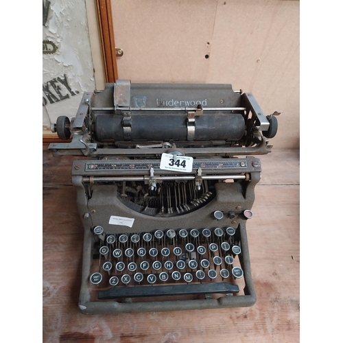 344 - 1950's Underwood typewriter. {27 cm H x 36 cm W x 31 cm D}.