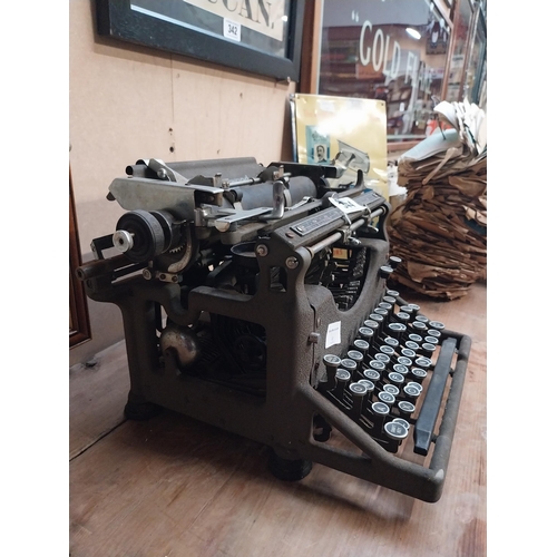 344 - 1950's Underwood typewriter. {27 cm H x 36 cm W x 31 cm D}.