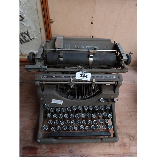 344 - 1950's Underwood typewriter. {27 cm H x 36 cm W x 31 cm D}.