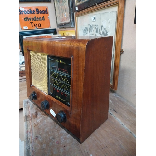 346 - 1950's wooden Bush radio. {34 cm H x 32 cm W x 18 cm D}.