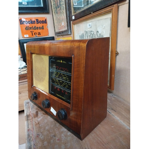 346 - 1950's wooden Bush radio. {34 cm H x 32 cm W x 18 cm D}.