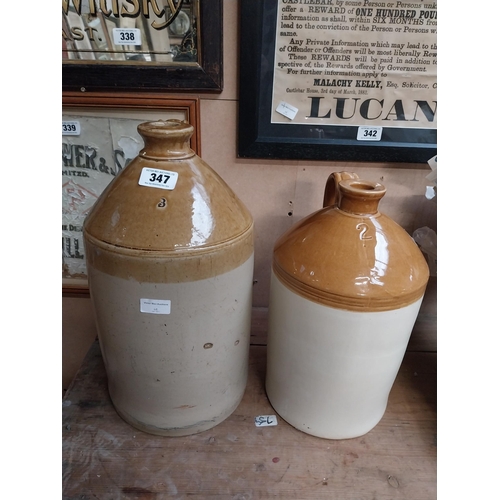 347 - Two stoneware flagons - two gallon and three gallon. {42 cm H x 23 cm Dia. and 32 cm H x 22 cm Dia}.