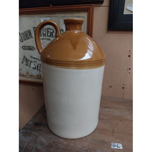 347 - Two stoneware flagons - two gallon and three gallon. {42 cm H x 23 cm Dia. and 32 cm H x 22 cm Dia}.