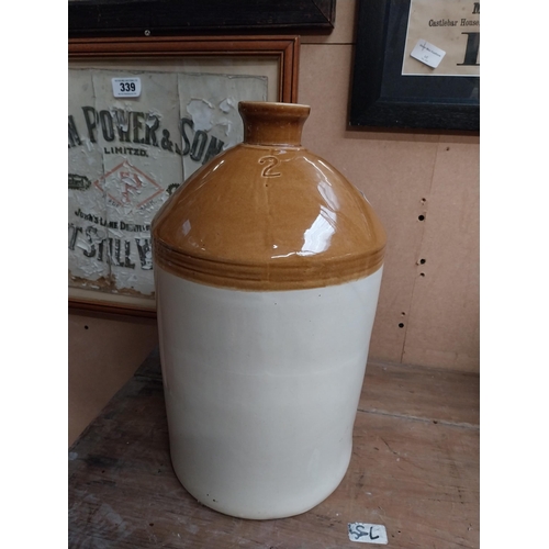 347 - Two stoneware flagons - two gallon and three gallon. {42 cm H x 23 cm Dia. and 32 cm H x 22 cm Dia}.