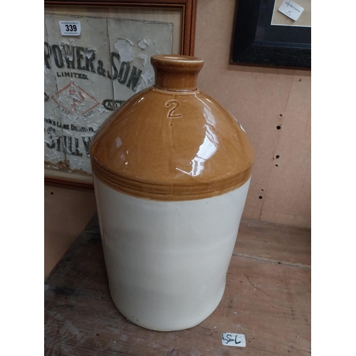 347 - Two stoneware flagons - two gallon and three gallon. {42 cm H x 23 cm Dia. and 32 cm H x 22 cm Dia}.