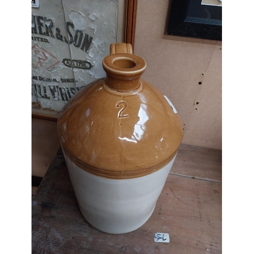 347 - Two stoneware flagons - two gallon and three gallon. {42 cm H x 23 cm Dia. and 32 cm H x 22 cm Dia}.