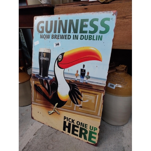 348 - Tin plate Guinness Now Brewed in Dublin advertising sign. {50 cm H x 38 cm Dia.}.