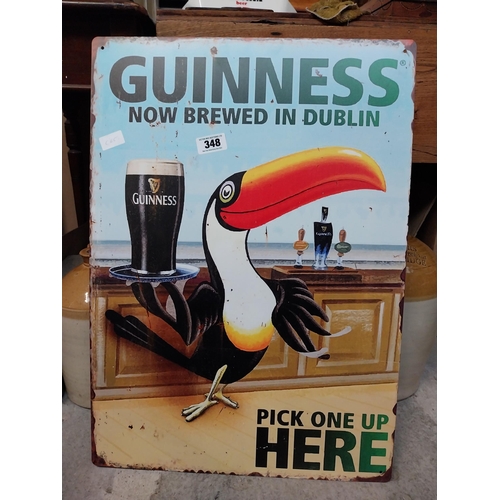 348 - Tin plate Guinness Now Brewed in Dublin advertising sign. {50 cm H x 38 cm Dia.}.