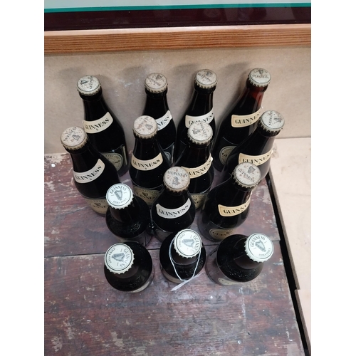 355 - Fourteen bottles of Guinness.