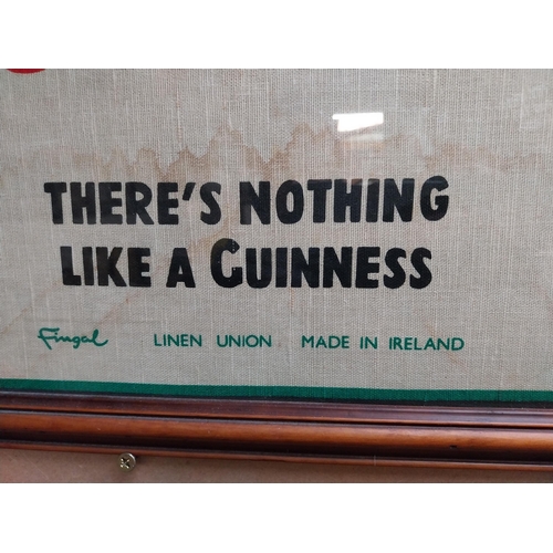 364 - Framed Guinness tea towel . {80 cm H x 50 cm W}.