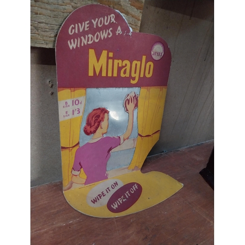 389 - Give Your Windows a Miraglo cardboard advertising showcard. {31 cm H x 18 cm W}