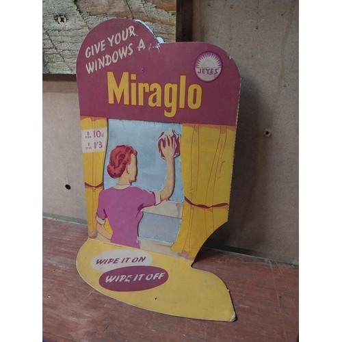 389 - Give Your Windows a Miraglo cardboard advertising showcard. {31 cm H x 18 cm W}